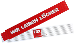 Picture of TOX 09969001 Meterstab 2 mtr. rot/weiß, mit Aufdruck: wir lieben Löcher, Gliedermaßstab für Heim & Handwerker, 1 Stück Zollstock